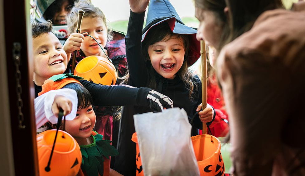 The Halloween custom of going from door to door saying “trick or treat” is especially popular for children